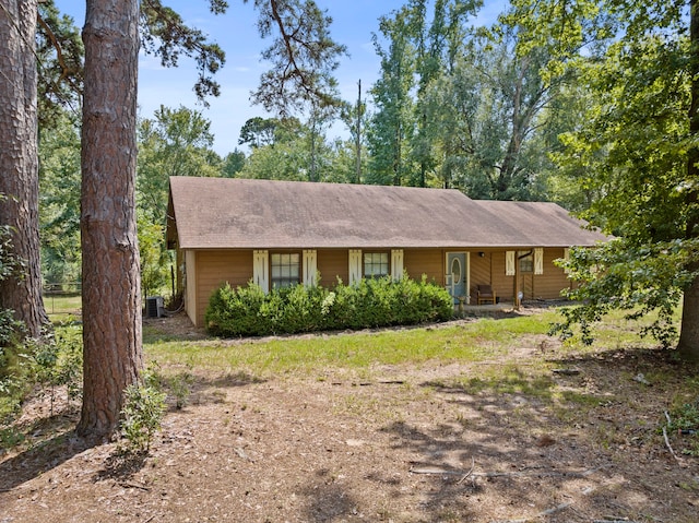 ranch-style house with central AC unit