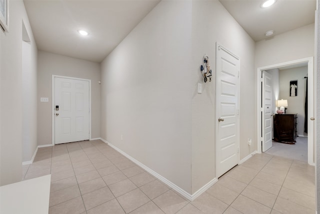 hallway with light tile patterned floors