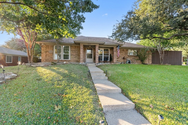 ranch-style home featuring a front yard