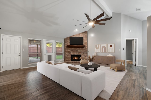 living room featuring beam ceiling, a fireplace, high vaulted ceiling, and dark wood-type flooring