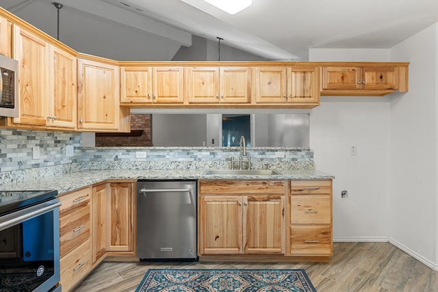 kitchen with appliances with stainless steel finishes, backsplash, light stone counters, sink, and vaulted ceiling with beams