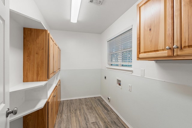 laundry area featuring cabinets, hookup for a washing machine, dark wood-type flooring, and hookup for an electric dryer