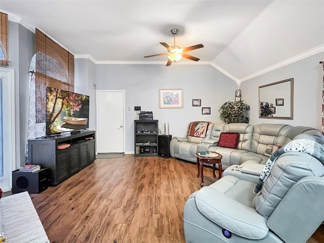 living room with wood-type flooring, lofted ceiling, ceiling fan, and crown molding