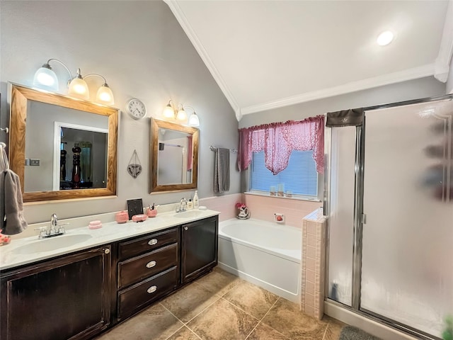 bathroom with tile patterned floors, vaulted ceiling, ornamental molding, vanity, and independent shower and bath