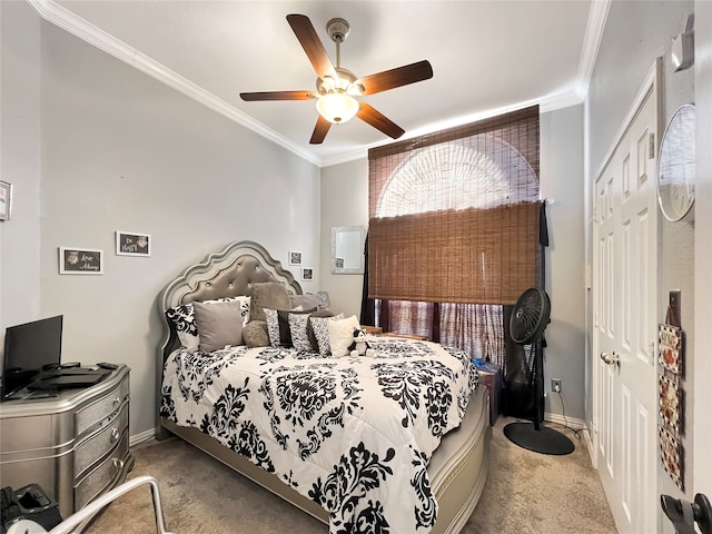 carpeted bedroom featuring a closet, ceiling fan, and crown molding