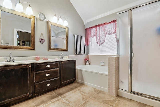 bathroom featuring tile patterned floors, ornamental molding, shower with separate bathtub, and vanity