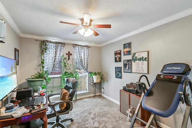 carpeted home office featuring a textured ceiling, ornamental molding, and ceiling fan