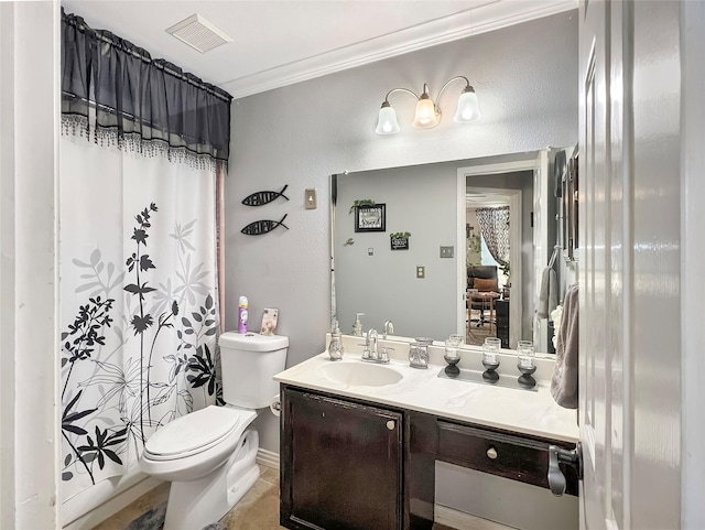 bathroom featuring ornamental molding, vanity, toilet, and tile patterned floors