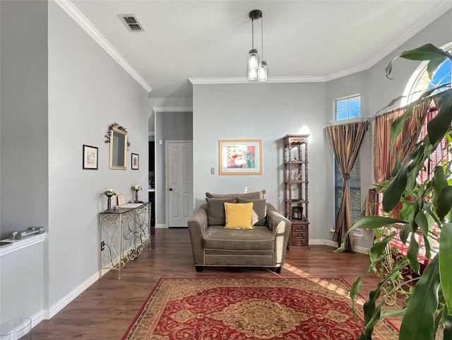 sitting room featuring dark hardwood / wood-style flooring and crown molding