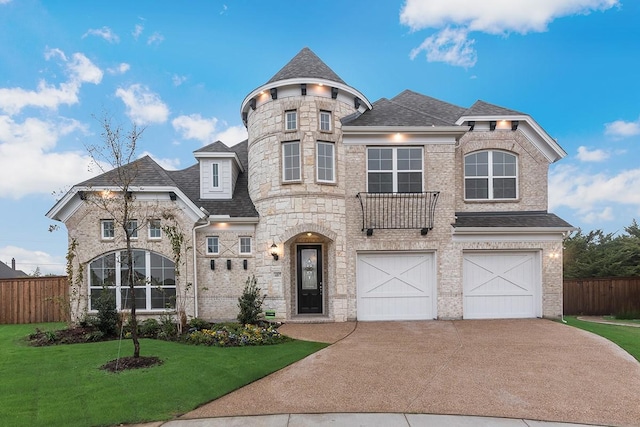 view of front of home with a garage and a front yard