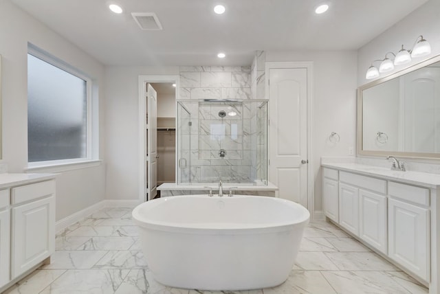 bathroom featuring vanity and separate shower and tub