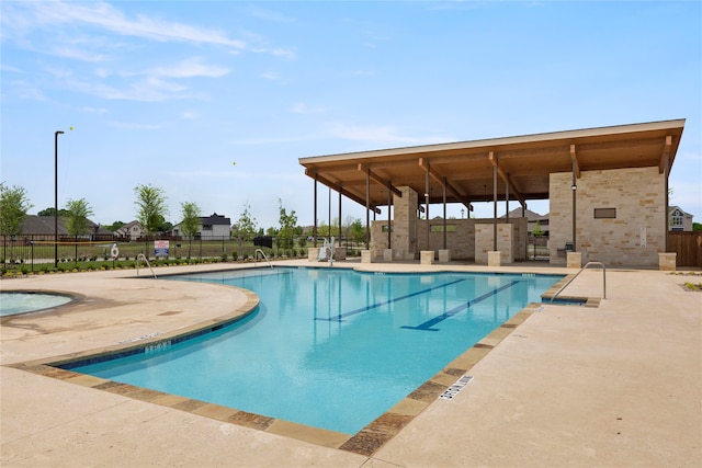 view of swimming pool with a patio