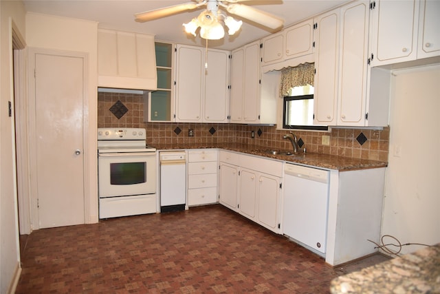 kitchen with white appliances, ceiling fan, sink, dark stone countertops, and white cabinetry