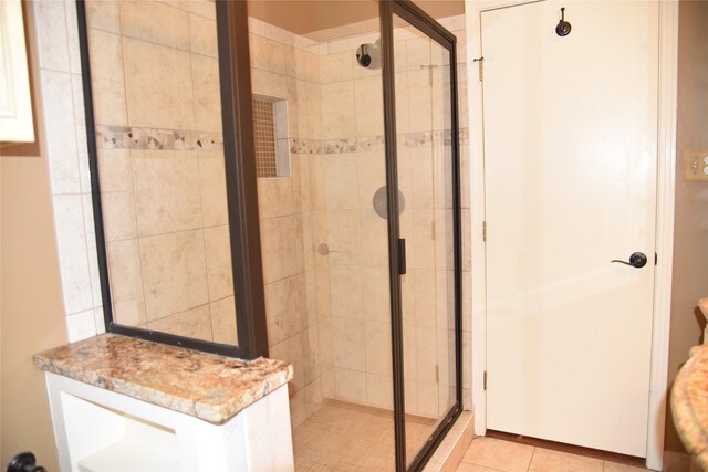 bathroom featuring tile patterned floors and walk in shower