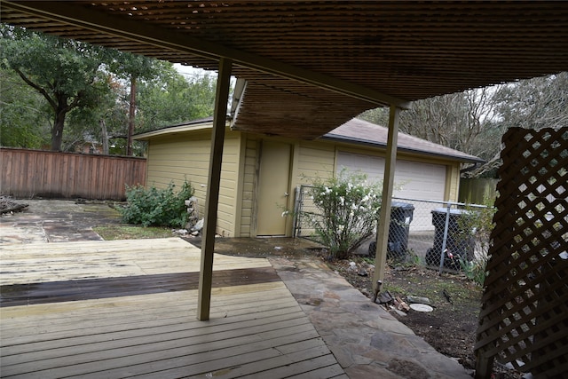 wooden terrace with a garage