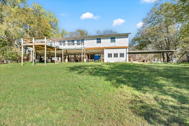 rear view of property with a lawn