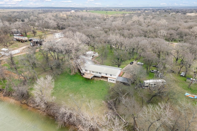 birds eye view of property with a wooded view