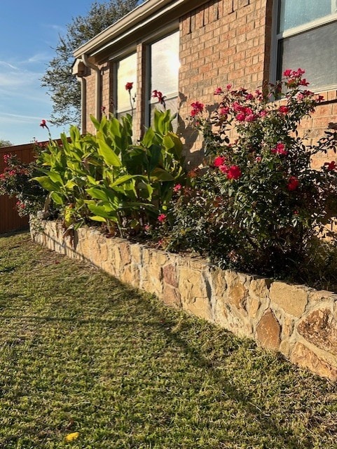 view of home's exterior with a lawn