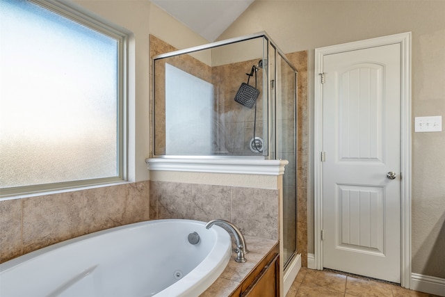 bathroom featuring tile patterned floors, independent shower and bath, and lofted ceiling