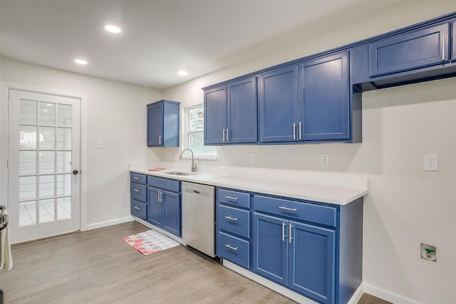 kitchen with sink, blue cabinets, dishwasher, and light hardwood / wood-style floors