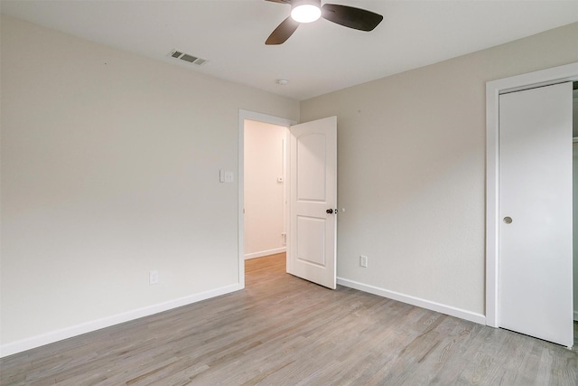 unfurnished bedroom featuring a closet, ceiling fan, and light hardwood / wood-style flooring