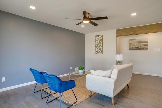 sitting room featuring recessed lighting, baseboards, and wood finished floors