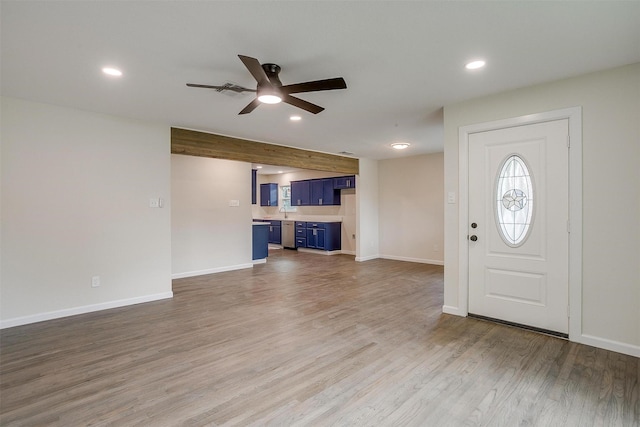 entryway with hardwood / wood-style floors and ceiling fan