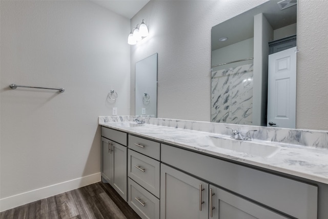 bathroom with wood-type flooring and vanity