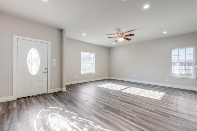 foyer entrance with light wood-type flooring and ceiling fan