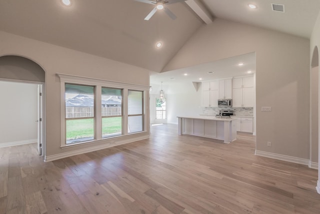 609 Keel Way, Azle, TX 76020 - unfurnished living room featuring a ceiling fan, beamed ceiling, light wood-type flooring, high vaulted ceiling, and recessed lighting