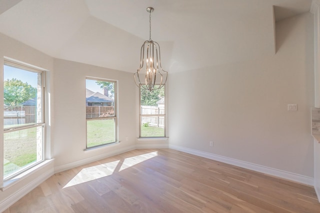 609 Keel Way, Azle, TX 76020 - spare room featuring a chandelier, light wood-style floors, and lofted ceiling