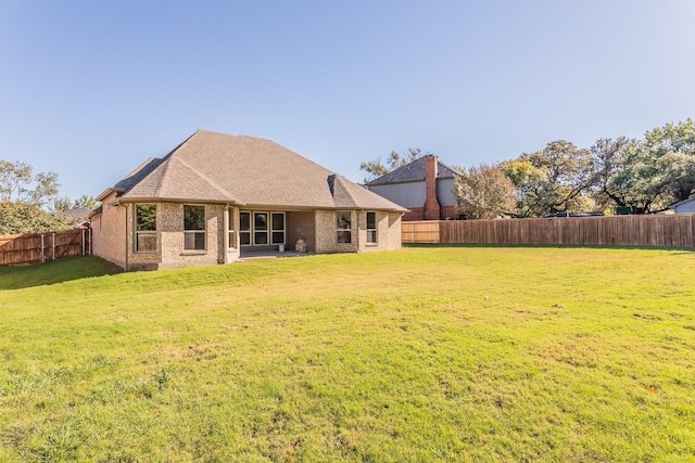 609 Keel Way, Azle, TX 76020 - rear view of house featuring brick siding, a fenced backyard, and roof with shingles