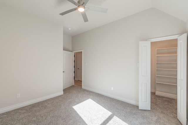 609 Keel Way, Azle, TX 76020 - unfurnished bedroom with light carpet, a spacious closet, vaulted ceiling, ceiling fan, and a closet