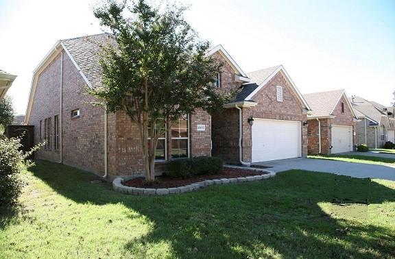 10133 Sanden, Mckinney, TX 75072 - view of front of property featuring concrete driveway, brick siding, a shingled roof, and a front lawn