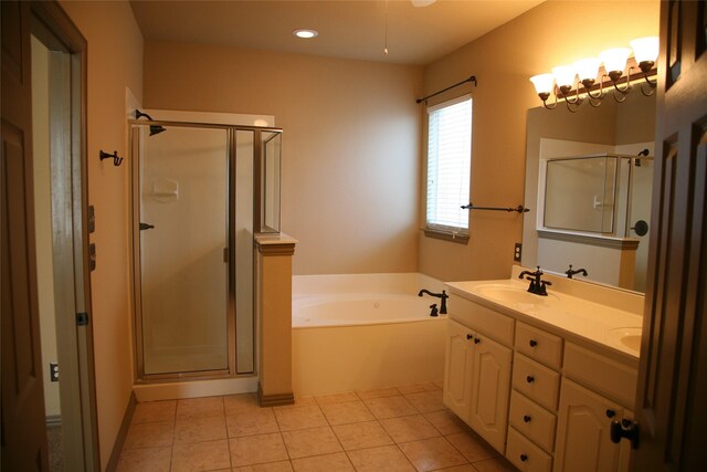 10133 Sanden, Mckinney, TX 75072 - full bathroom featuring a garden tub, a sink, tile patterned flooring, and a shower stall