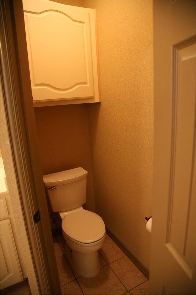 10133 Sanden, Mckinney, TX 75072 - bathroom featuring toilet, tile patterned floors, and baseboards
