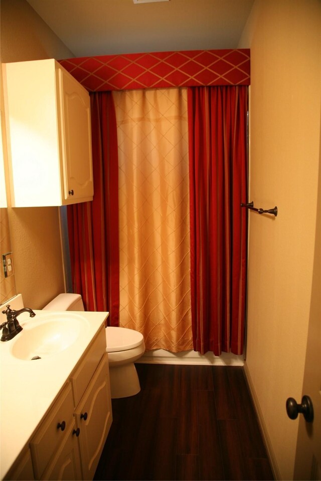 10133 Sanden, Mckinney, TX 75072 - full bath featuring vanity, shower / tub combo, wood finished floors, and toilet
