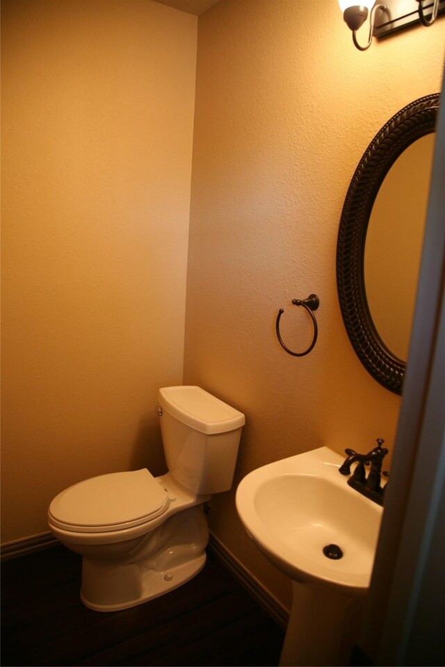 10133 Sanden, Mckinney, TX 75072 - half bath featuring a sink, baseboards, and toilet