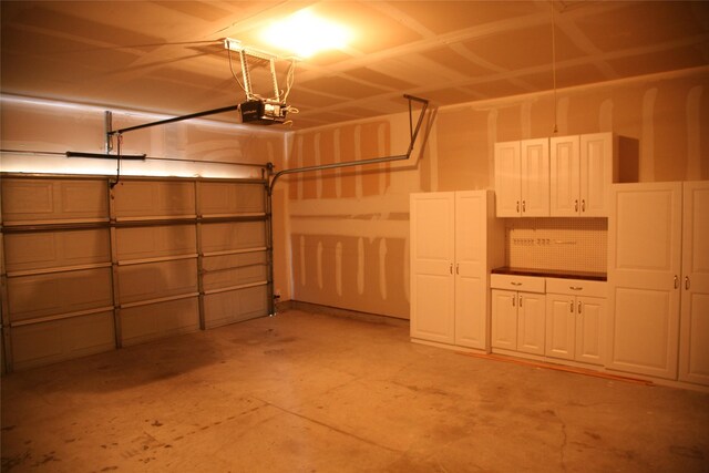 10133 Sanden, Mckinney, TX 75072 - garage featuring a garage door opener