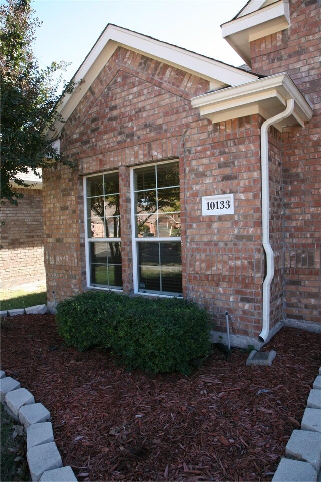 10133 Sanden, Mckinney, TX 75072 - view of home's exterior featuring brick siding