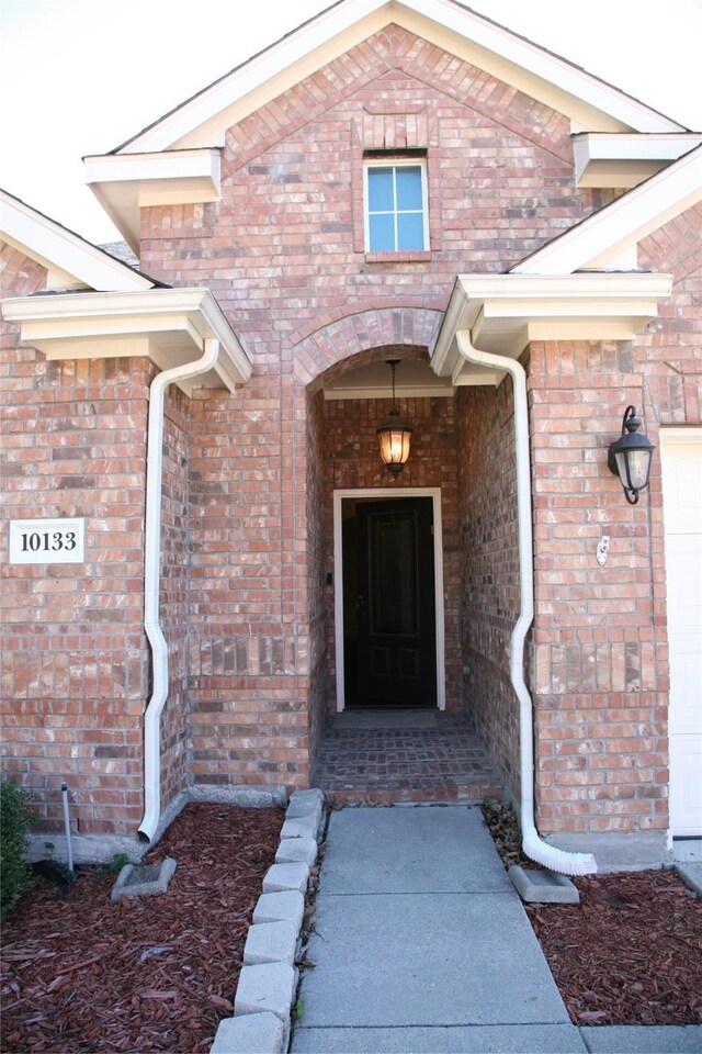 10133 Sanden, Mckinney, TX 75072 - view of exterior entry featuring brick siding