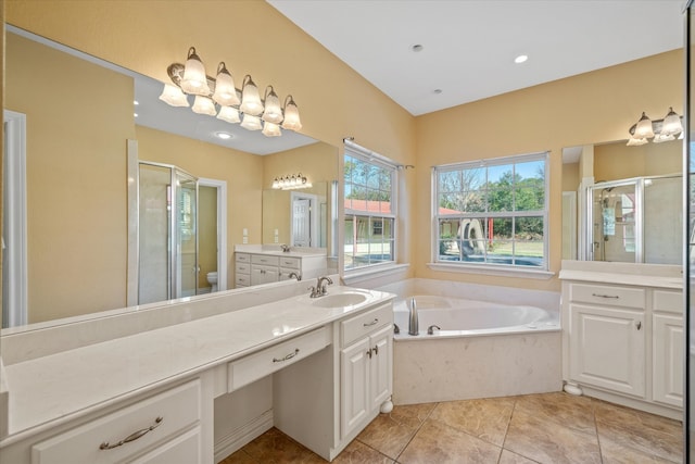 full bathroom with tile patterned floors, vanity, independent shower and bath, and toilet