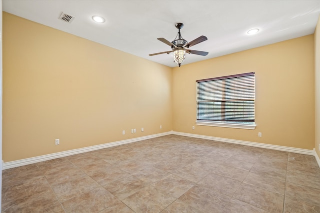 unfurnished room with ceiling fan