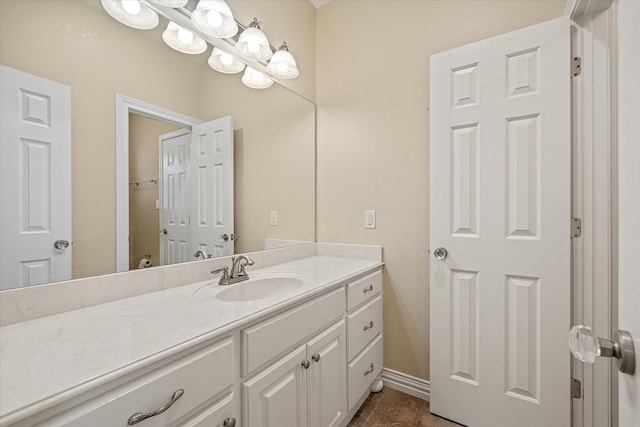 bathroom with tile patterned flooring and vanity