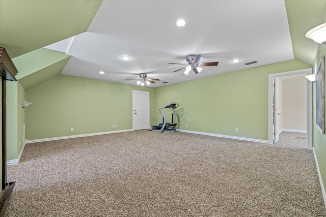 interior space featuring carpet, vaulted ceiling, and ceiling fan