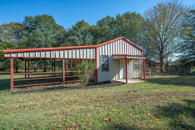 view of outdoor structure with a lawn