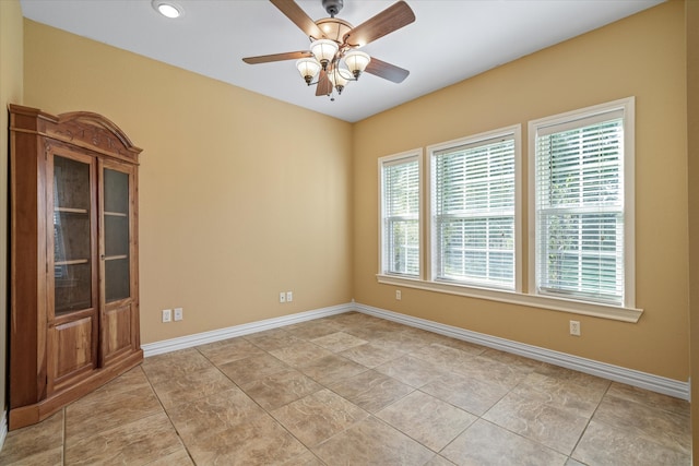 unfurnished room with ceiling fan