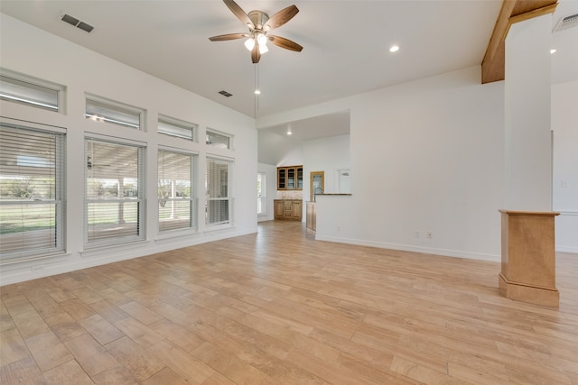 unfurnished living room with ceiling fan and light wood-type flooring