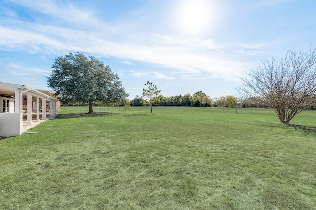 view of yard with a rural view