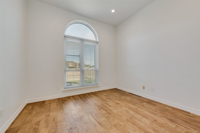 unfurnished room with a healthy amount of sunlight and light wood-type flooring